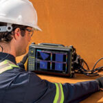 Male technician facing the VEO 3, analyzing scans